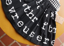 Load image into Gallery viewer, Hazel Skirt Size 5 Black and White lettering print